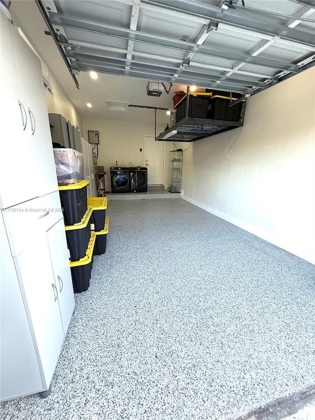 garage featuring a garage door opener and washing machine and dryer