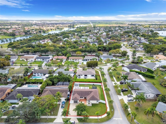 bird's eye view with a residential view and a water view