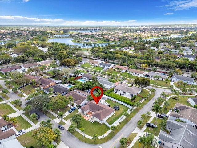 birds eye view of property featuring a water view and a residential view