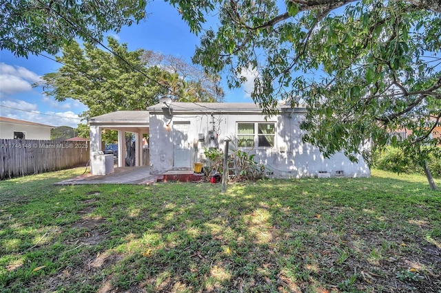 view of front of house with a patio area and a front lawn