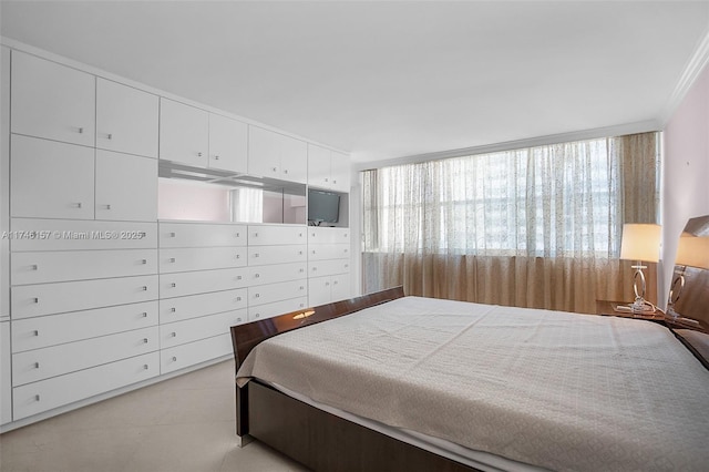 bedroom featuring multiple windows and crown molding