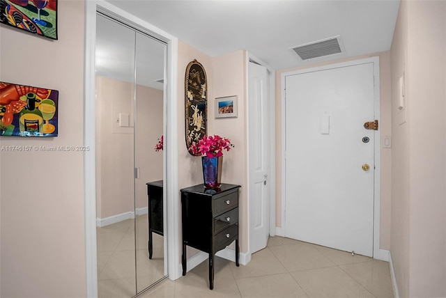 interior space with light tile patterned floors