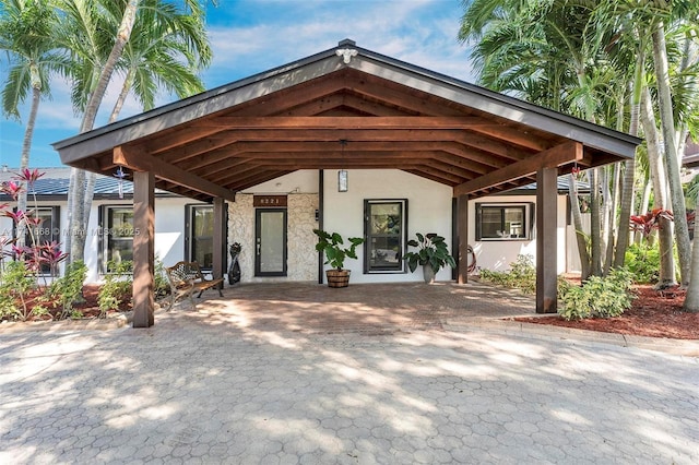 exterior space with a carport