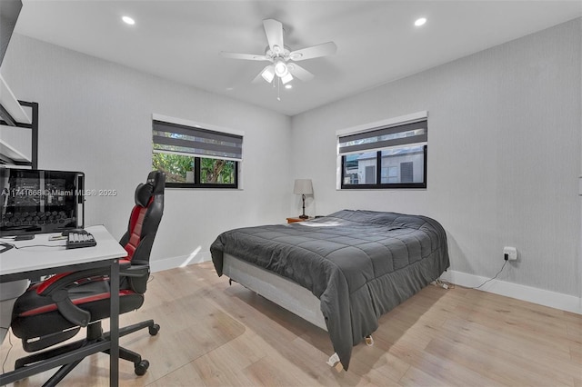 bedroom with baseboards, light wood-style flooring, and recessed lighting