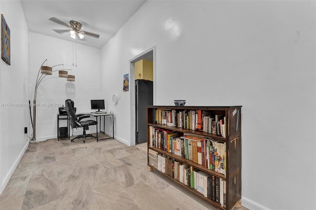 home office with ceiling fan and baseboards