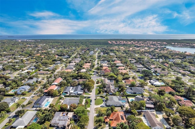 aerial view featuring a water view and a residential view