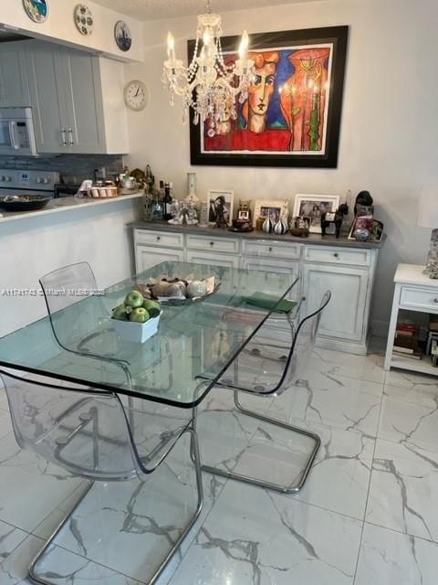 dining space featuring a chandelier