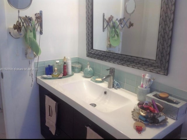 bathroom with vanity and backsplash