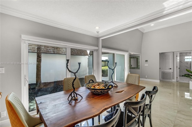 dining space with crown molding and a textured ceiling