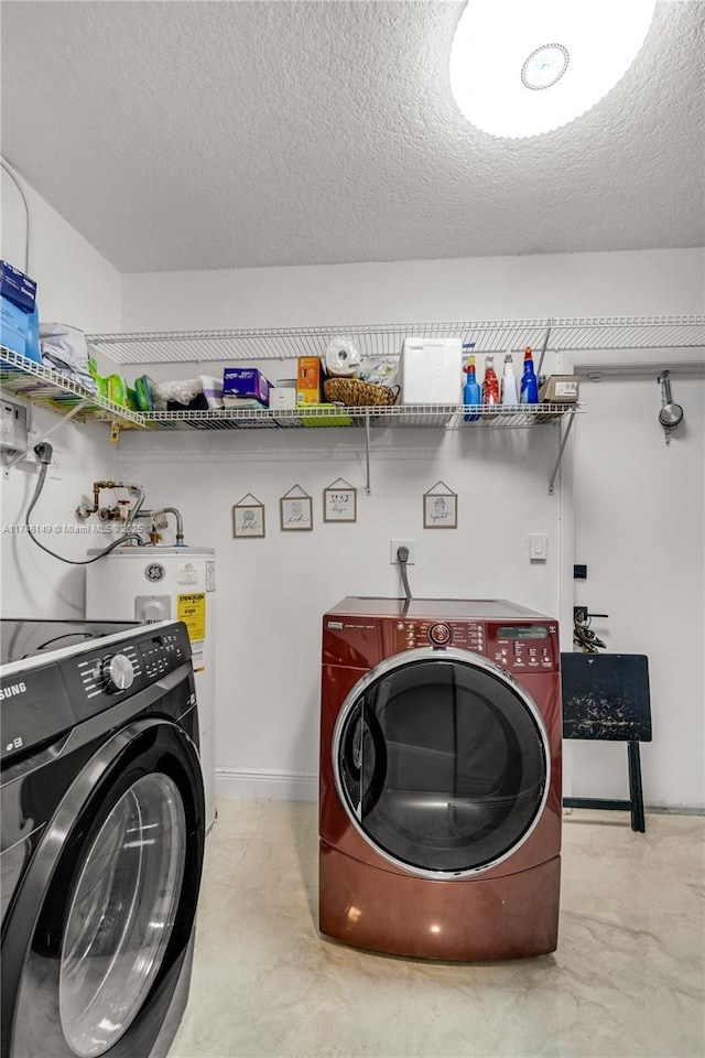 washroom featuring separate washer and dryer, sink, and a textured ceiling