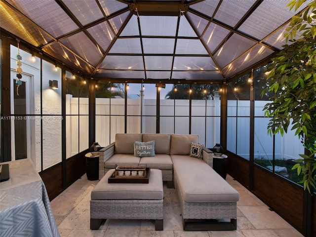 sunroom / solarium with lofted ceiling