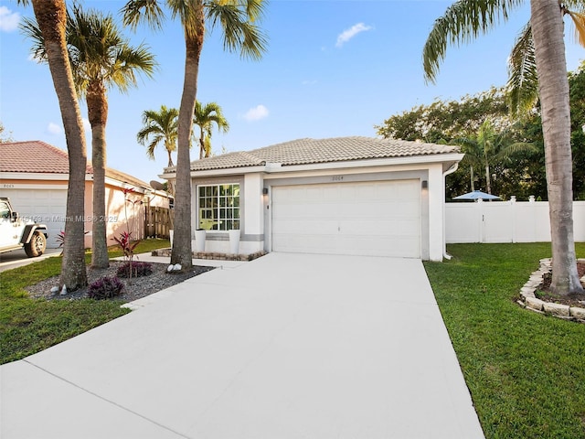 view of front facade featuring a garage and a front yard