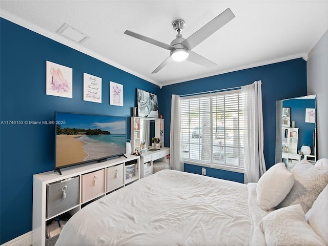 bedroom with ornamental molding and ceiling fan