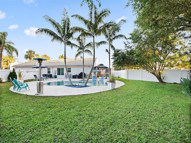 view of yard featuring a gazebo, a fenced in pool, and a patio