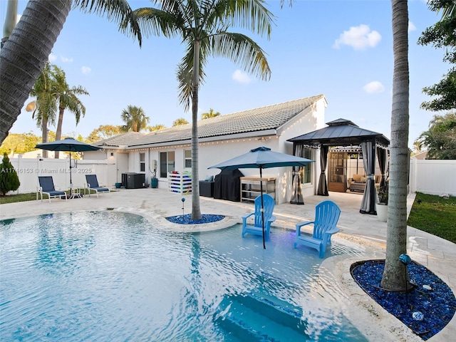 view of pool with a gazebo, a patio area, and central AC