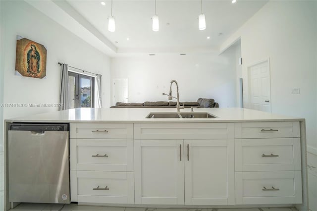 kitchen featuring french doors, sink, dishwasher, pendant lighting, and white cabinets