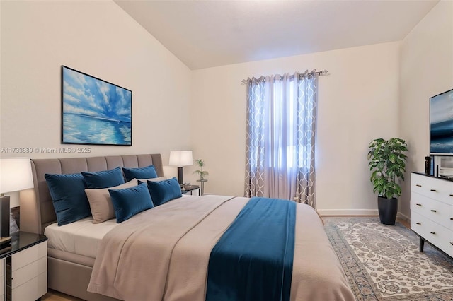 bedroom with lofted ceiling