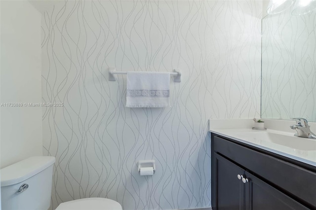 bathroom with vanity and toilet