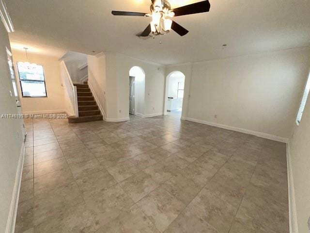 unfurnished living room with ceiling fan