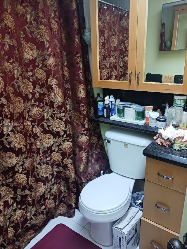 bathroom with tile patterned floors and toilet