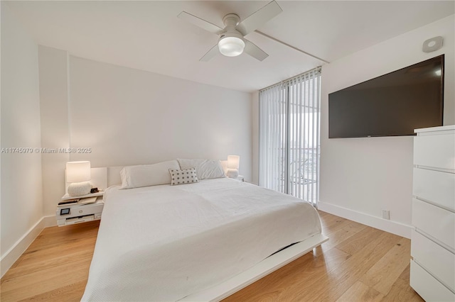 bedroom featuring ceiling fan and light hardwood / wood-style floors