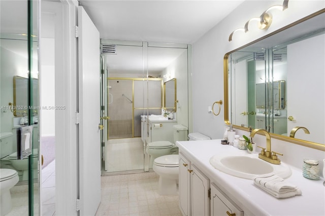 full bathroom with toilet, vanity, and a shower stall
