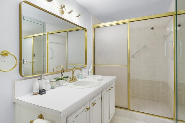 bathroom featuring vanity and a stall shower