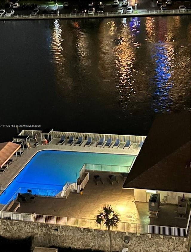 view of pool with a water view