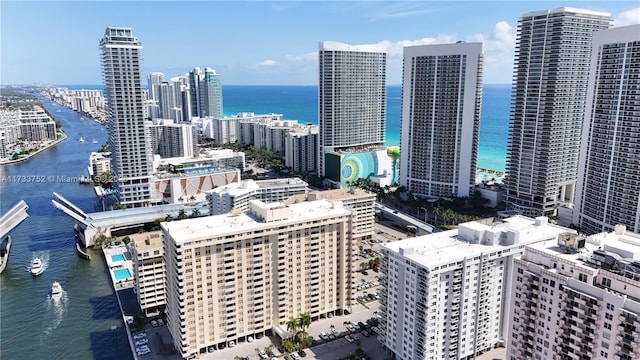 birds eye view of property featuring a water view and a view of city