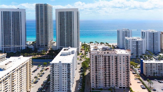 birds eye view of property featuring a view of city and a water view
