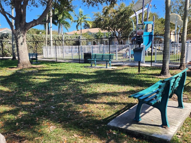 surrounding community with a yard and a playground