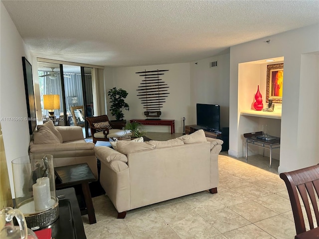 tiled living room with a textured ceiling