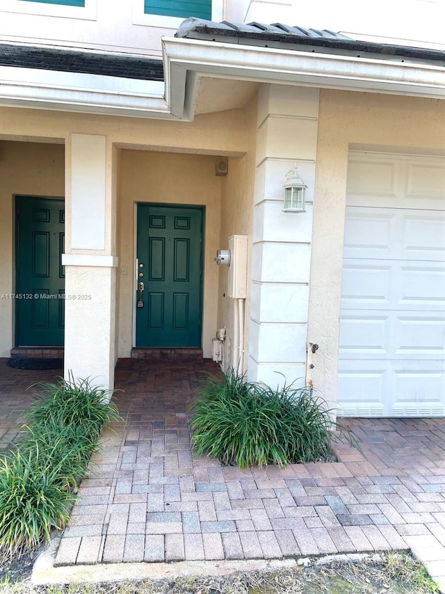 entrance to property featuring a garage