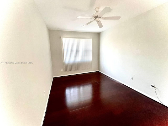 empty room featuring wood-type flooring and ceiling fan