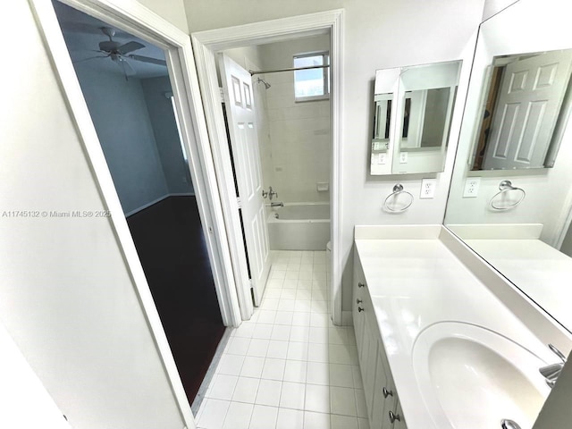 bathroom featuring vanity, tiled shower / bath combo, tile patterned floors, and ceiling fan