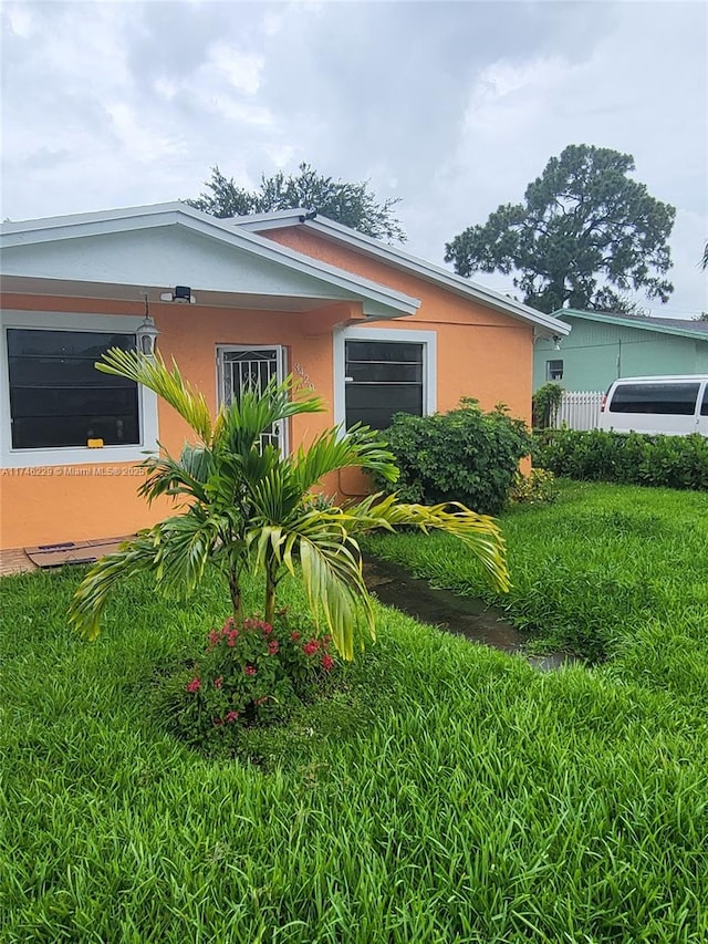 exterior space with a front yard