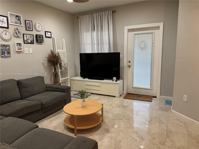 living room featuring ceiling fan