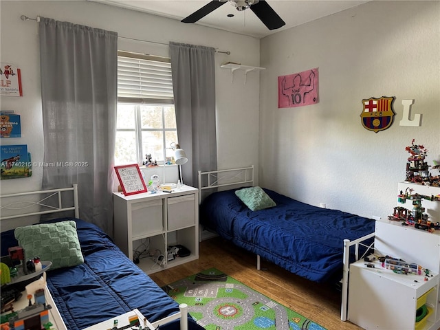 bedroom featuring ceiling fan and light hardwood / wood-style floors