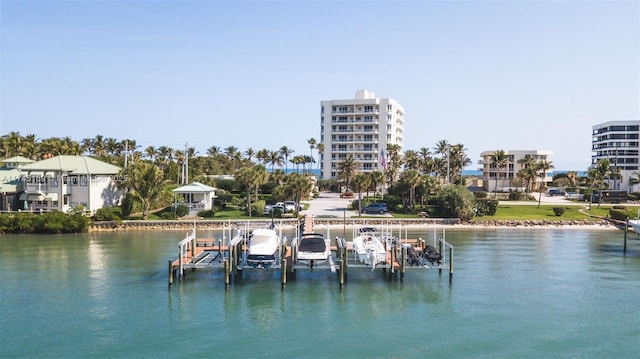 dock area with a water view and boat lift