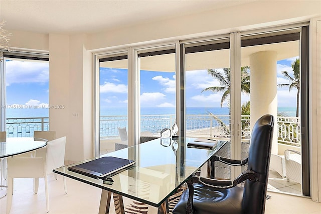 dining area featuring a water view