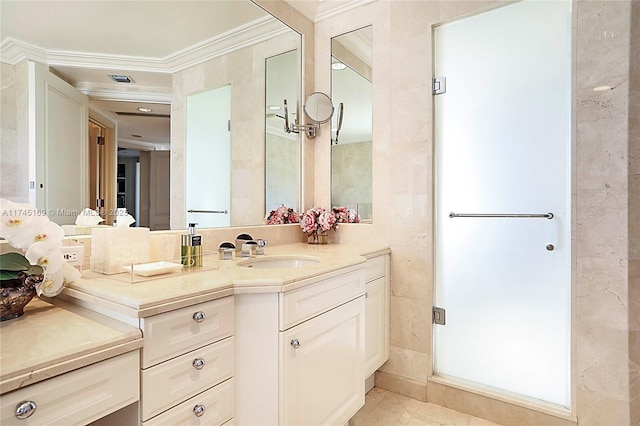 bathroom with ornamental molding and vanity