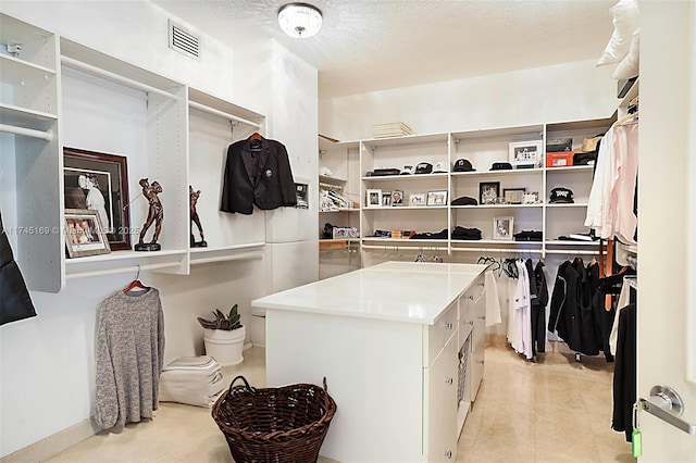 walk in closet with visible vents