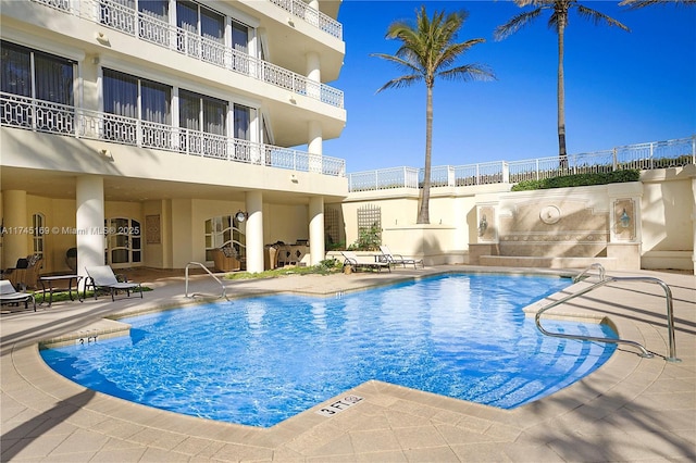 pool with a patio area