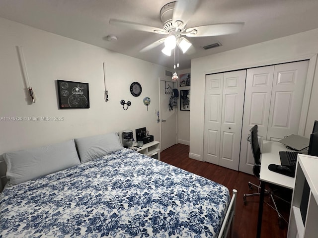 bedroom featuring dark hardwood / wood-style flooring, a closet, and ceiling fan