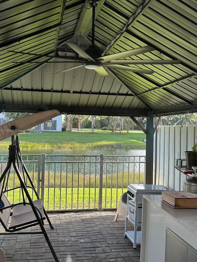 view of patio / terrace featuring a gazebo and a water view