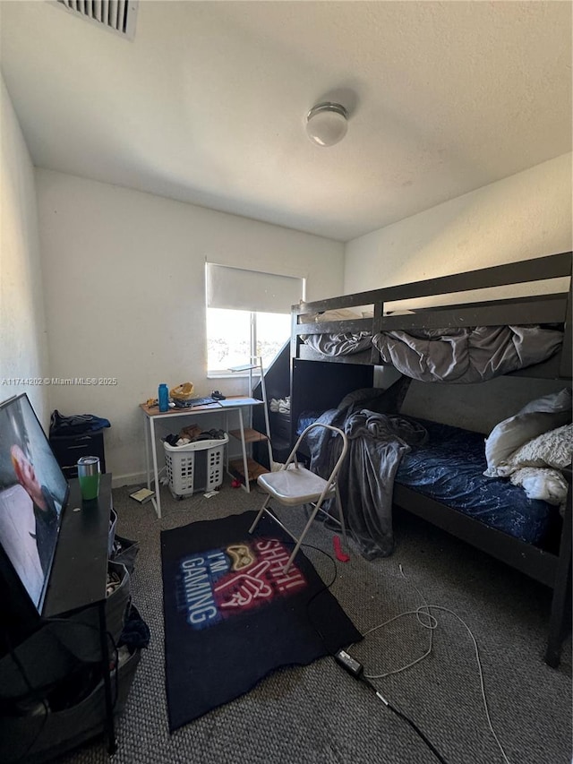 bedroom featuring visible vents and carpet flooring