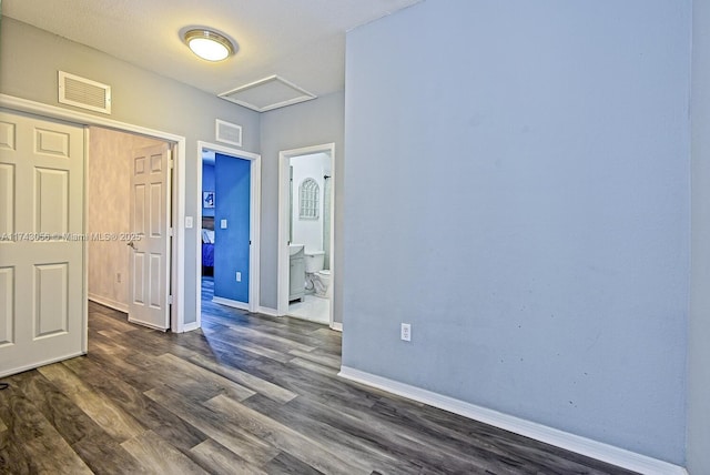 spare room with dark wood-type flooring