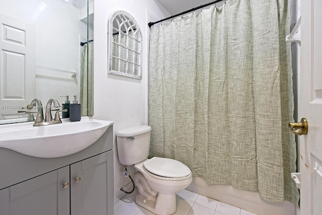 bathroom with vanity, tile patterned floors, and toilet