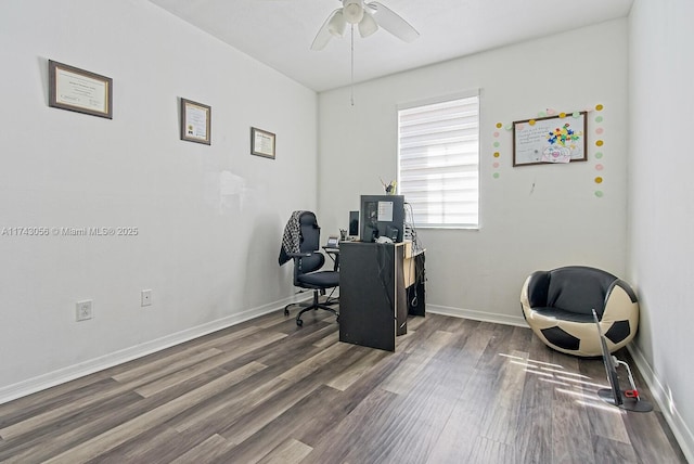 office with dark wood-type flooring and ceiling fan