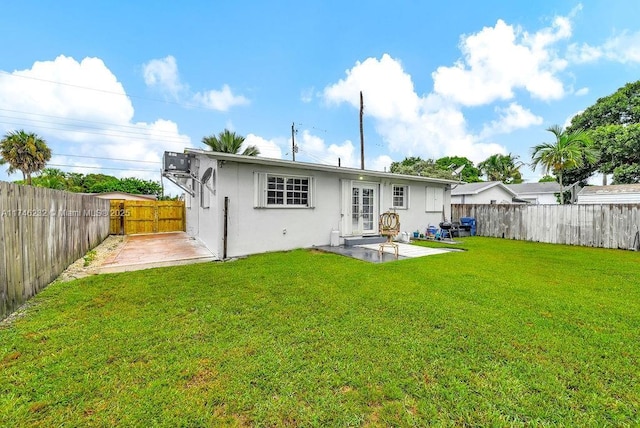713 SW 6th Ave, Hallandale Beach, FL 33009 - back of house with a yard and a patio area